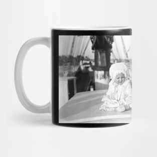 Baby and dog on large boat Mug